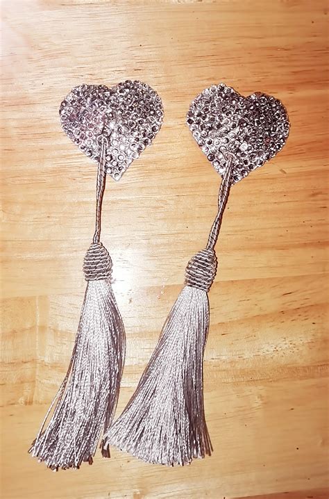Worn by strippers and burlesque artists, nipple tassles (tassels) consist of a small piece of material with sequins on one side and backing on the other. . Vine nipple tassles